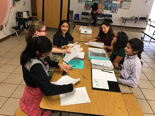 AmeriSchools students collaborating on a project